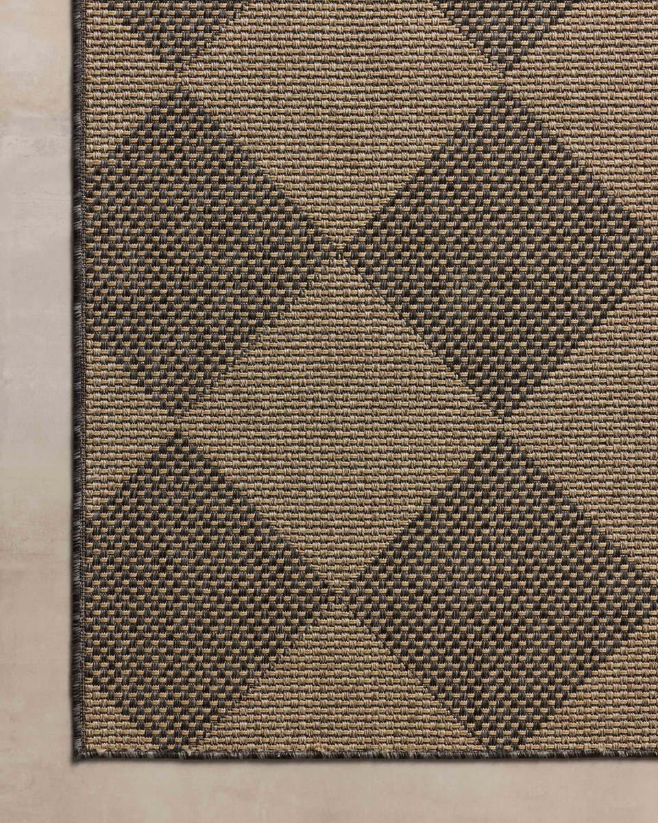 Natural fiber rug with geometric diamond pattern in tan and charcoal