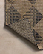 Natural fiber rug with geometric diamond pattern in tan and charcoal