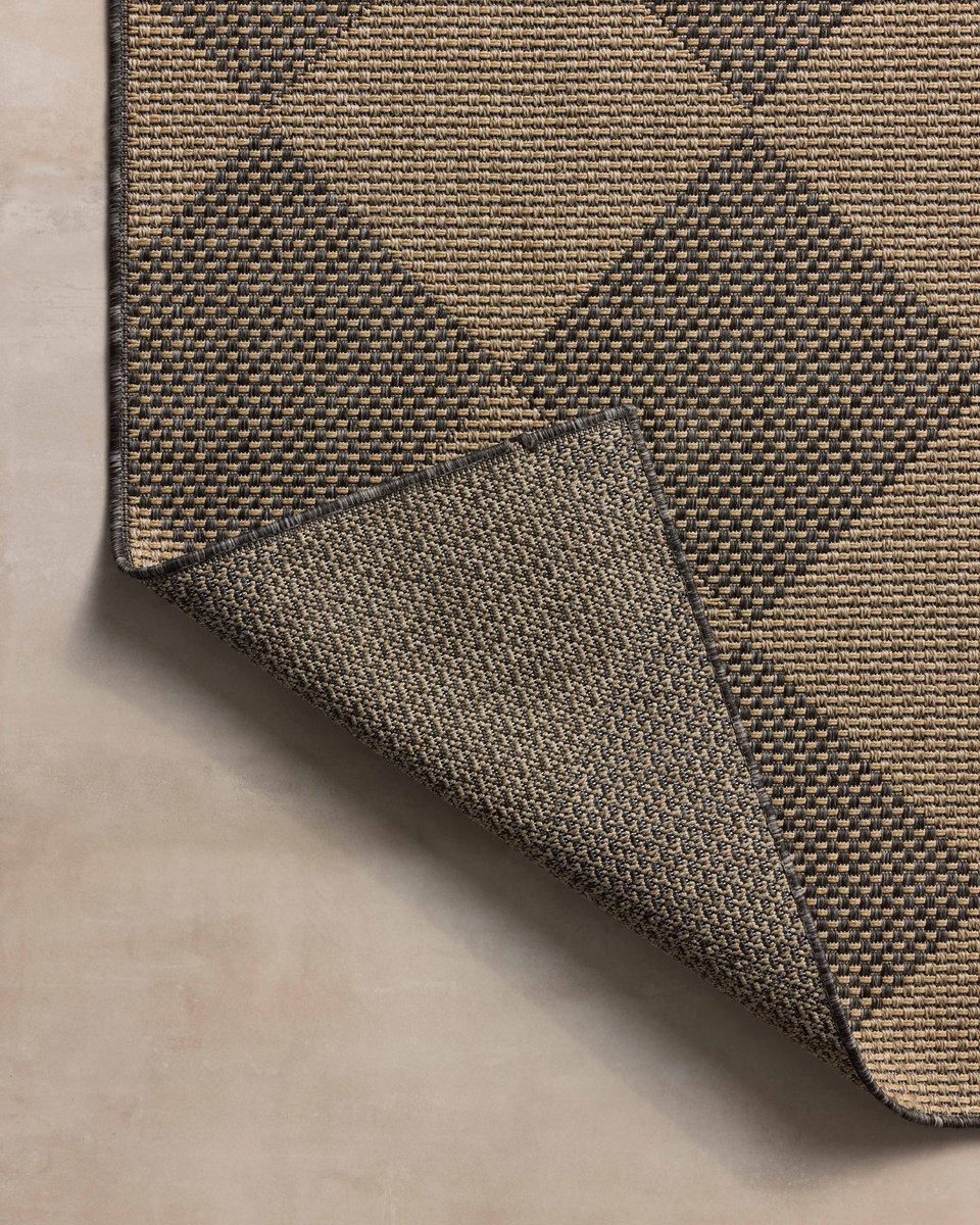 Natural fiber rug with geometric diamond pattern in tan and charcoal