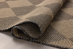 Natural fiber rug with geometric diamond pattern in tan and charcoal