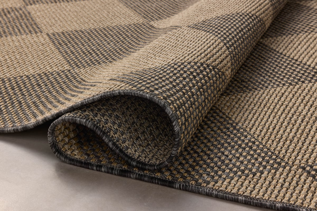 Natural fiber rug with geometric diamond pattern in tan and charcoal