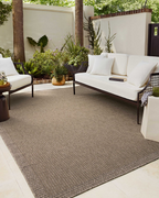 Neutral beige textured woven rug with fine ribbed pattern throughout
