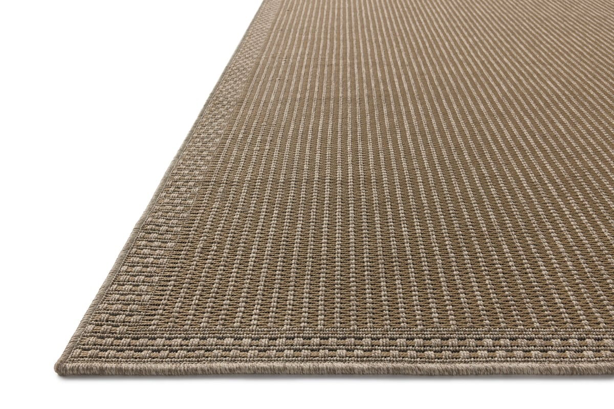 Neutral beige textured woven rug with fine ribbed pattern throughout
