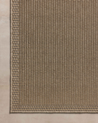 Neutral beige textured woven rug with fine ribbed pattern throughout