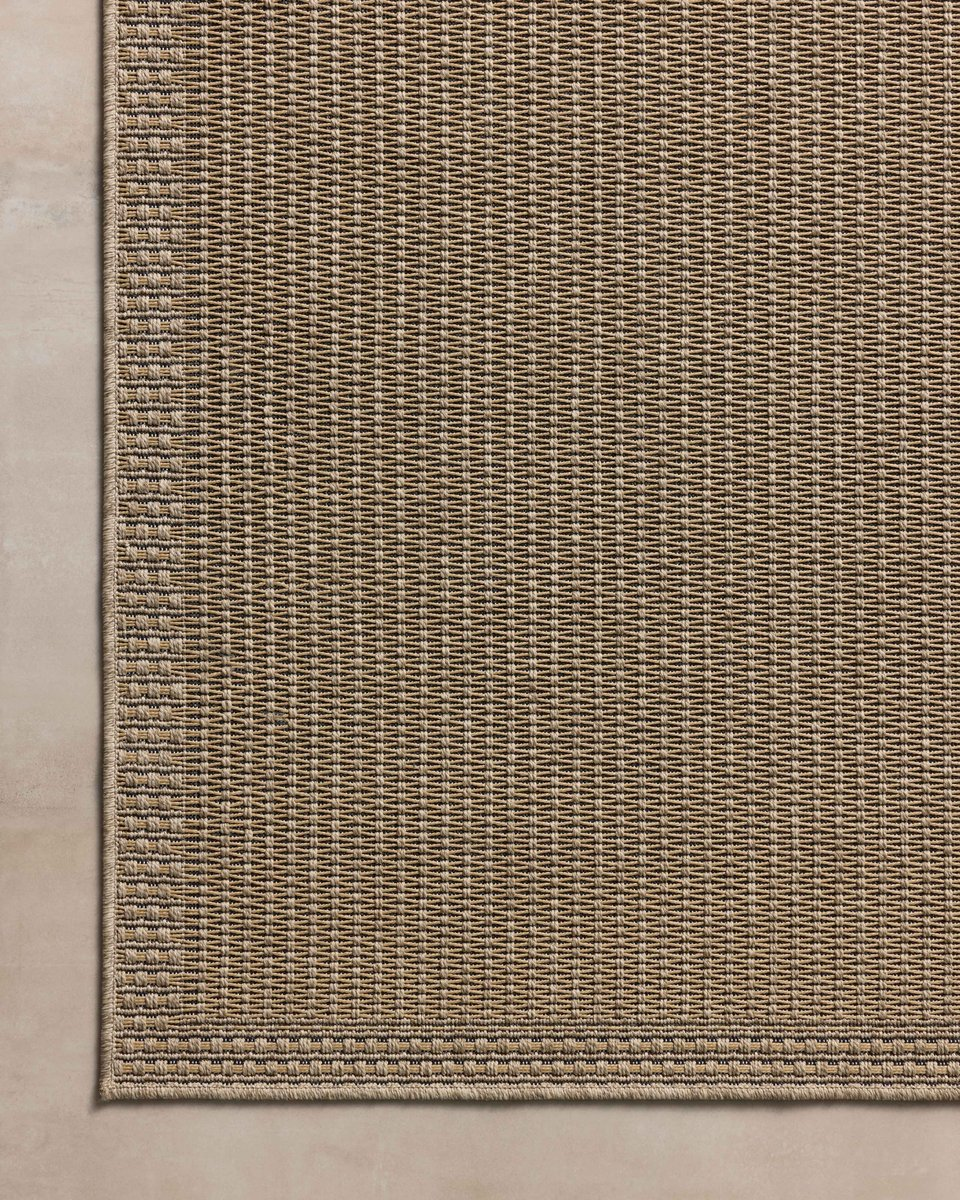 Neutral beige textured woven rug with fine ribbed pattern throughout