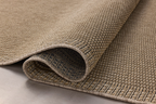 Neutral beige textured woven rug with fine ribbed pattern throughout