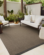 Neutral striped rug with subtle texture and dark border detail