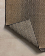 Neutral striped rug with subtle texture and dark border detail