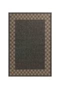 Charcoal grey and tan bordered outdoor rug in modern patio seating area