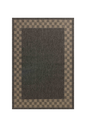 Charcoal grey and tan bordered outdoor rug in modern patio seating area
