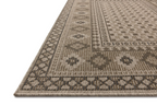 Beige geometric patterned rug with diamond motifs and decorative borders