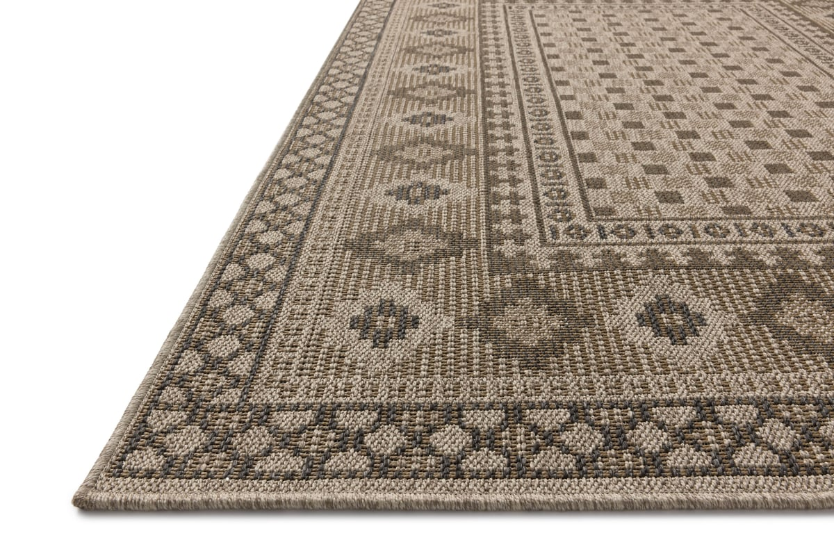 Beige geometric patterned rug with diamond motifs and decorative borders