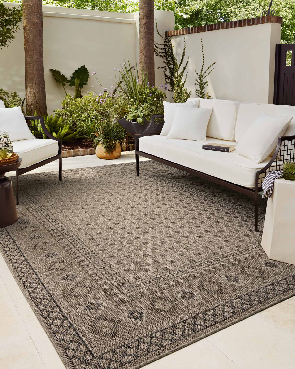 Beige geometric patterned rug with diamond motifs and decorative borders