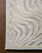 Cream wavy line patterned rug with organic swirled texture design