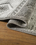 Gray geometric diamond pattern area rug with tribal motifs and striped borders