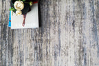 Modern striped area rug in grey, blue and cream with textured woven pattern
