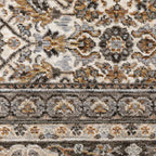 Traditional ornate rug with cream and brown geometric floral border pattern