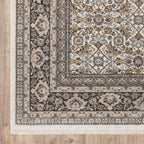 Traditional ornate rug with cream and brown geometric floral border pattern