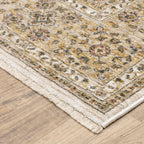 Cream and gold traditional rug with ornate floral patterns and decorative border