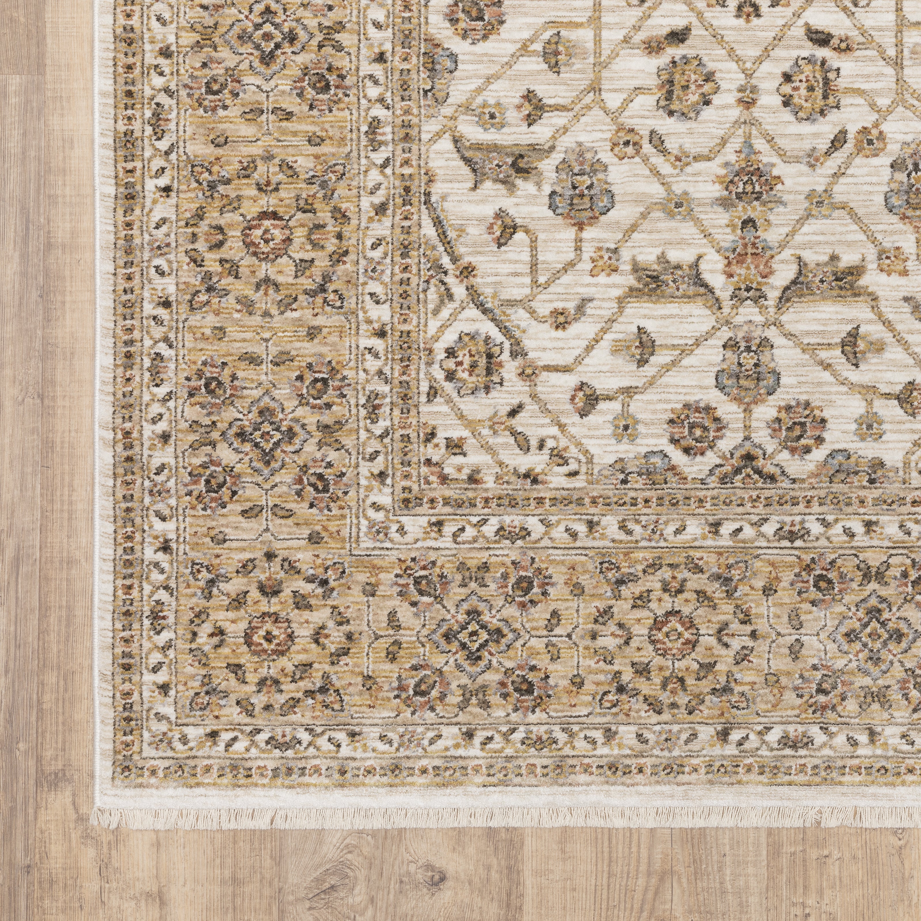Cream and gold traditional rug with ornate floral patterns and decorative border
