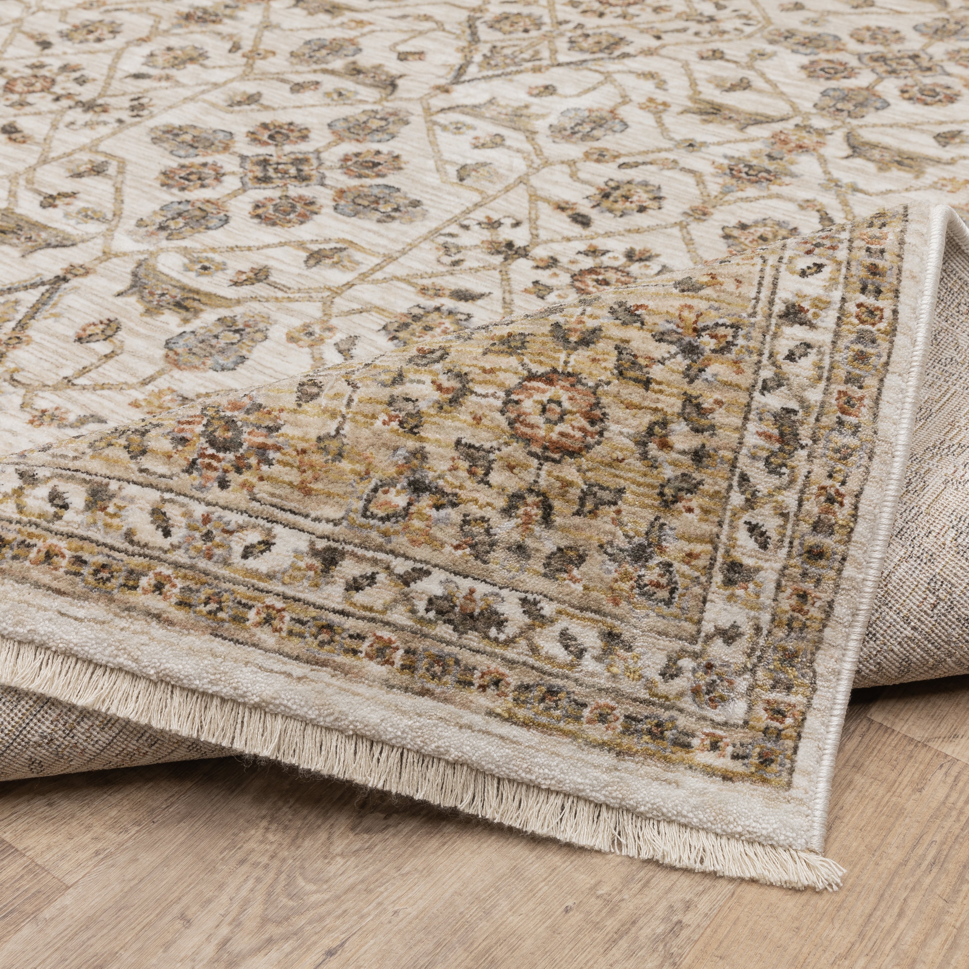 Cream and gold traditional rug with ornate floral patterns and decorative border