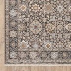 Vintage-style area rug with intricate geometric patterns in beige, taupe and cream tones
