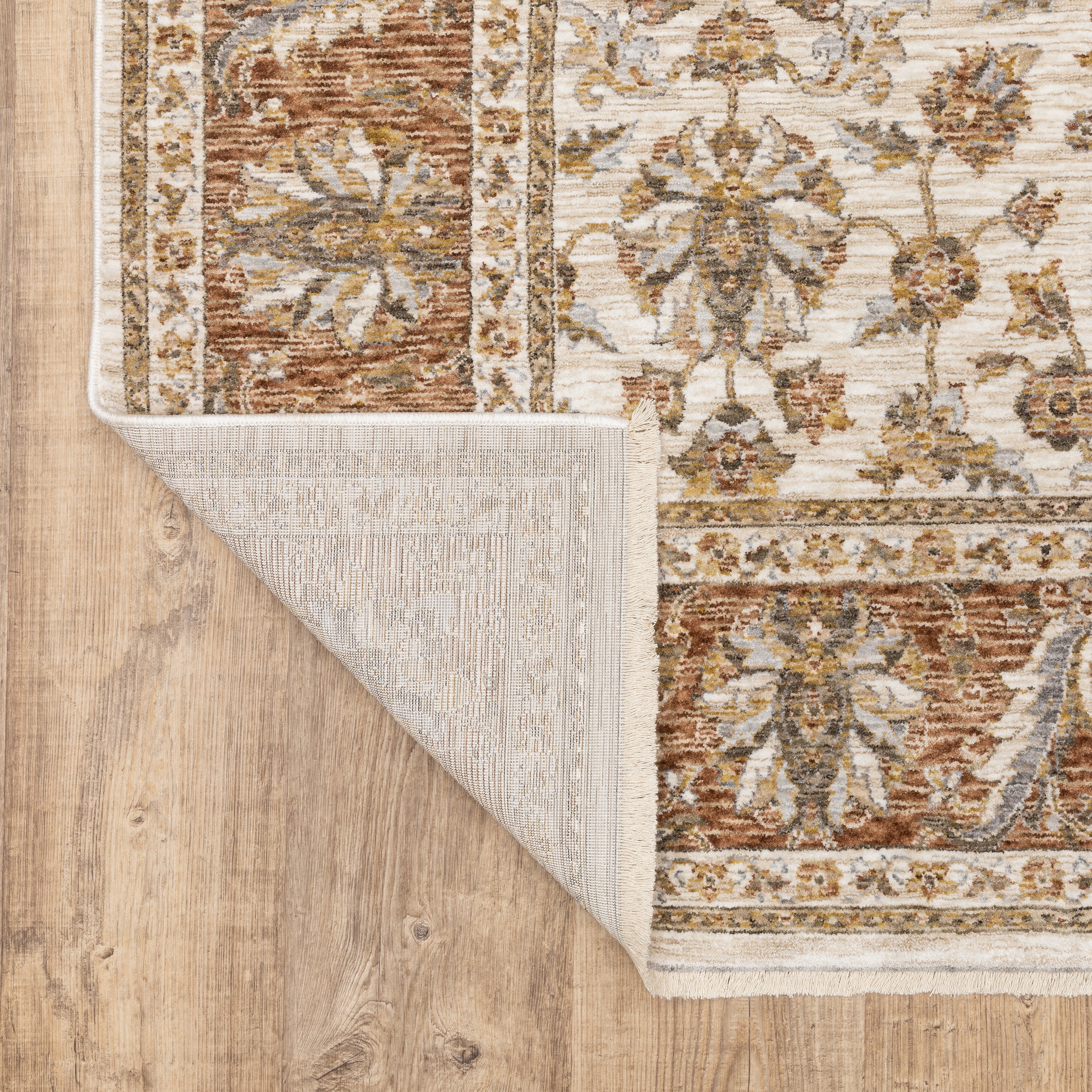 Classic floral pattern rug with cream center, terracotta border and ornate medallion design