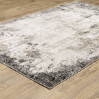 Vintage distressed grey and cream rug with abstract mottled texture pattern