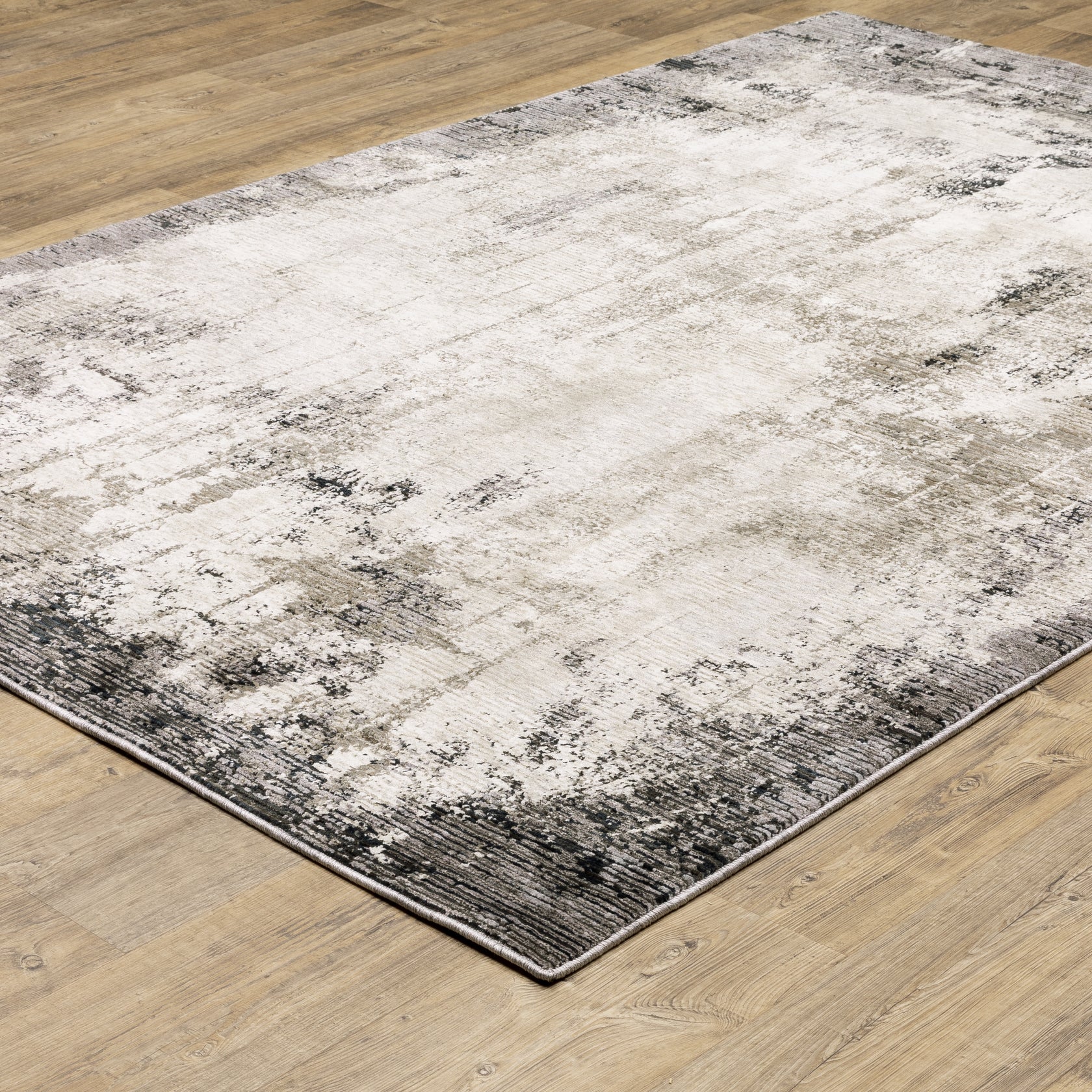 Vintage distressed grey and cream rug with abstract mottled texture pattern