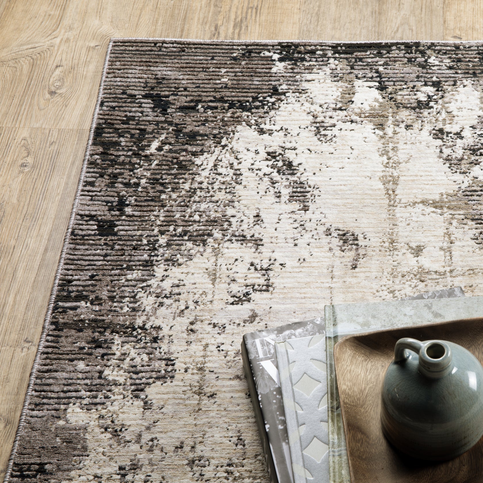 Vintage distressed grey and cream rug with abstract mottled texture pattern