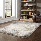 Vintage distressed grey and cream rug with abstract mottled texture pattern