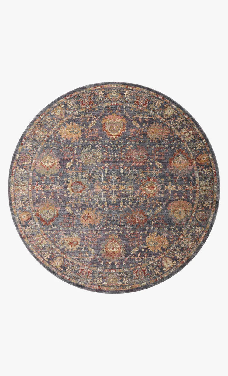 Vintage-style area rug with ornate floral medallions in blue, rust, and gold tones