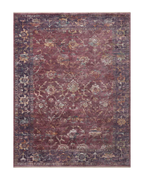 Burgundy distressed rug with ornate floral patterns in cream and rust tones