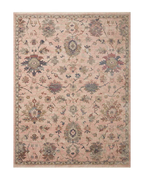 Blush pink traditional rug with intricate floral motifs and ornate border design