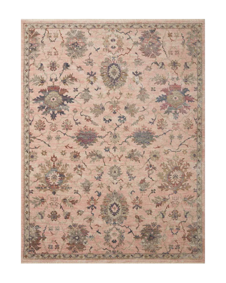 Blush pink traditional rug with intricate floral motifs and ornate border design