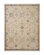 Vintage-style area rug with cream base, intricate geometric and floral patterns in rust and blue tones