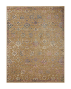 Vintage-inspired area rug with warm tan, blue, and purple tones in traditional pattern