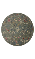 Vintage-style rug with blue-gray base and faded floral pattern in cream and red tones