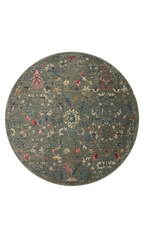 Vintage-style rug with blue-gray base and faded floral pattern in cream and red tones