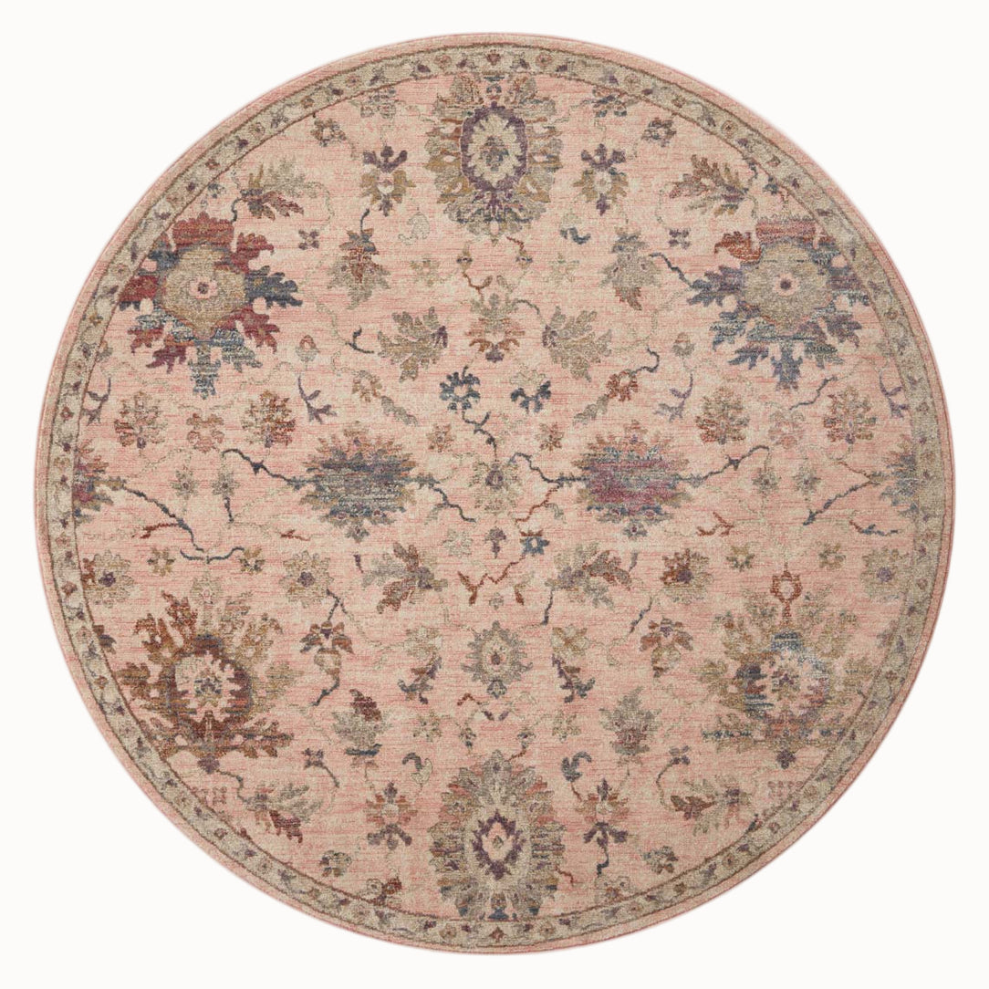 Blush pink traditional rug with intricate floral motifs and ornate border design