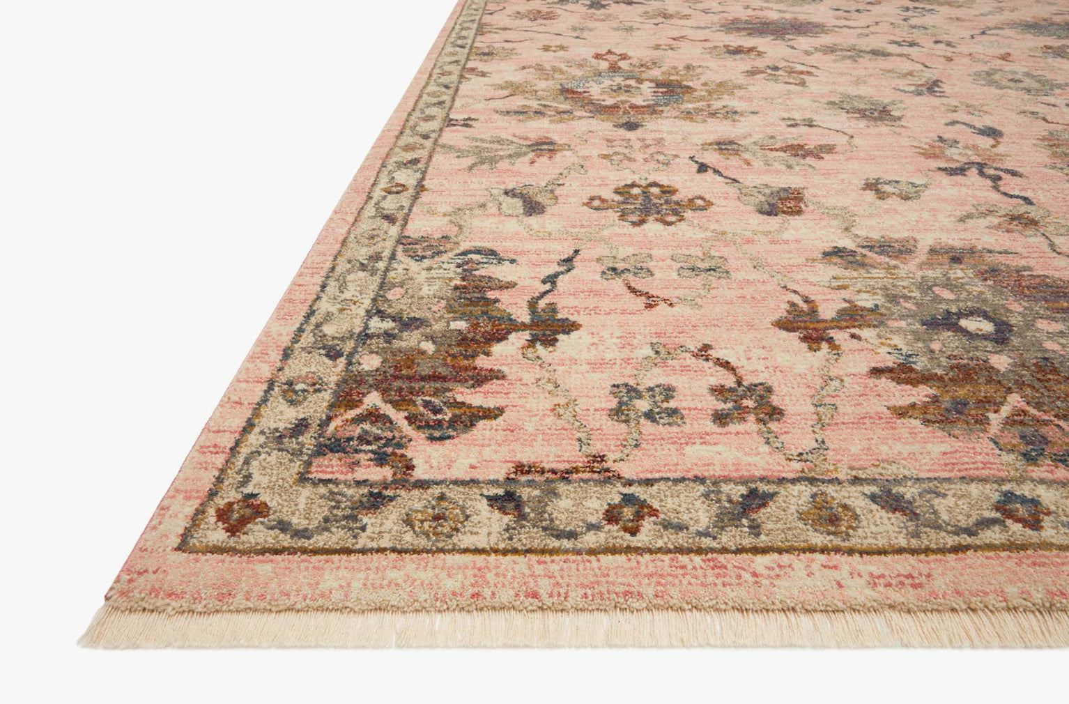 Blush pink traditional rug with intricate floral motifs and ornate border design
