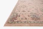 Blush pink traditional rug with intricate floral motifs and ornate border design