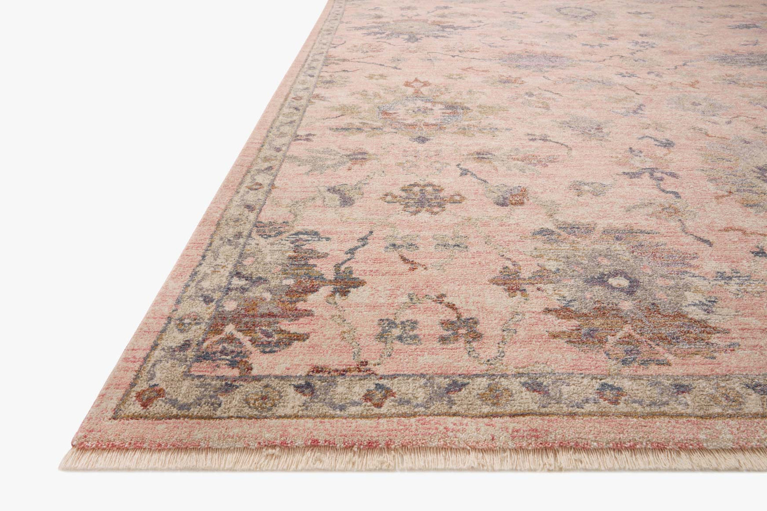 Blush pink traditional rug with intricate floral motifs and ornate border design