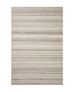 Neutral striped outdoor rug in beige and grey tones on patio
