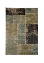 Modern geometric patchwork rug in green, black, and neutral tones with textured weave