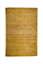 Golden yellow velvet rug with subtle grid texture pattern and worn vintage finish