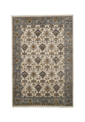 Cream and blue traditional rug with geometric diamond patterns and ornate border