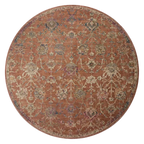 Vintage-style area rug with rust red background and ornate floral damask pattern in cream and blue tones
