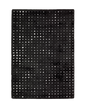 Black wool rug with white polka dot pattern and textured pile surface