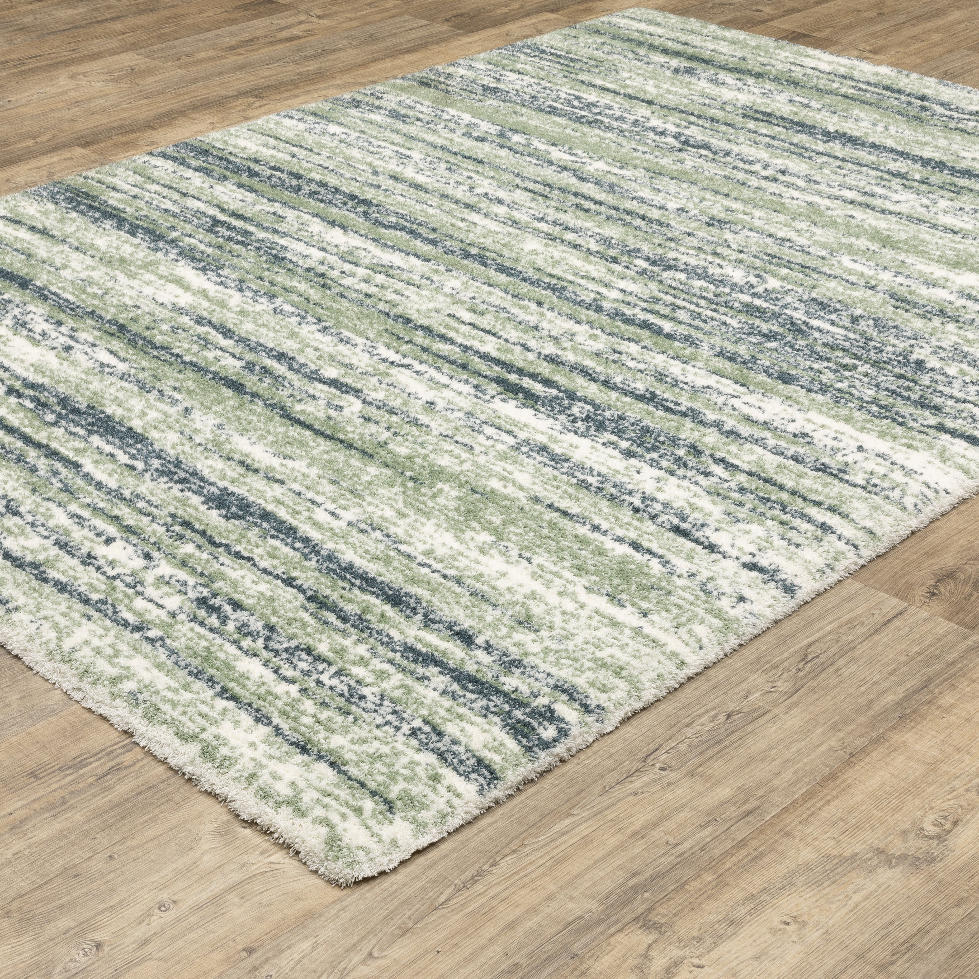Striped area rug with green, navy and cream horizontal bands in textured weave
